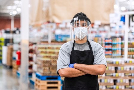 Warehouse worker in sanitation mask